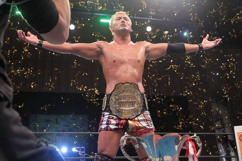 Kazuchika Okada with the IWGP Heavyweight Championship